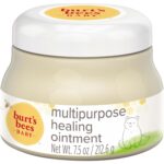 A white tub of Burt's Bees Baby 100% Natural Origin Multipurpose Healing Ointment with a yellow label.