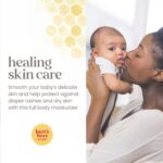 A white tub of Burt's Bees Baby 100% Natural Origin Multipurpose Healing Ointment with a yellow label.