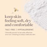 A white bottle of Burt's Bees Baby Dusting Powder with a yellow label and a picture of a baby.