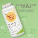 A white bottle of Burt's Bees Baby Dusting Powder with a yellow label and a picture of a baby.