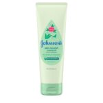 Close-up of a bottle of creamy baby oil with aloe and vitamin E, designed for moisturizing delicate skin.