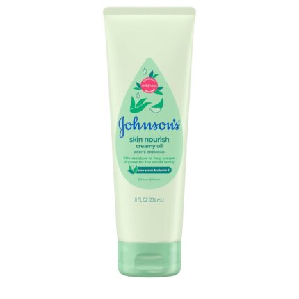 Close-up of a bottle of creamy baby oil with aloe and vitamin E, designed for moisturizing delicate skin.