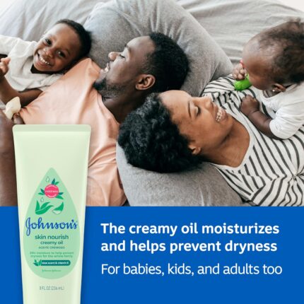 Close-up of a bottle of creamy baby oil with aloe and vitamin E, designed for moisturizing delicate skin.