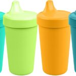 Four Re-Play spill-proof sippy cups in aqua, lime, yellow, and teal with lids and silicone valves.