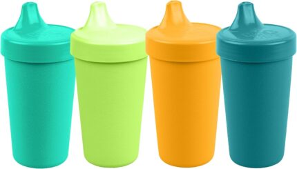 Four Re-Play spill-proof sippy cups in aqua, lime, yellow, and teal with lids and silicone valves.